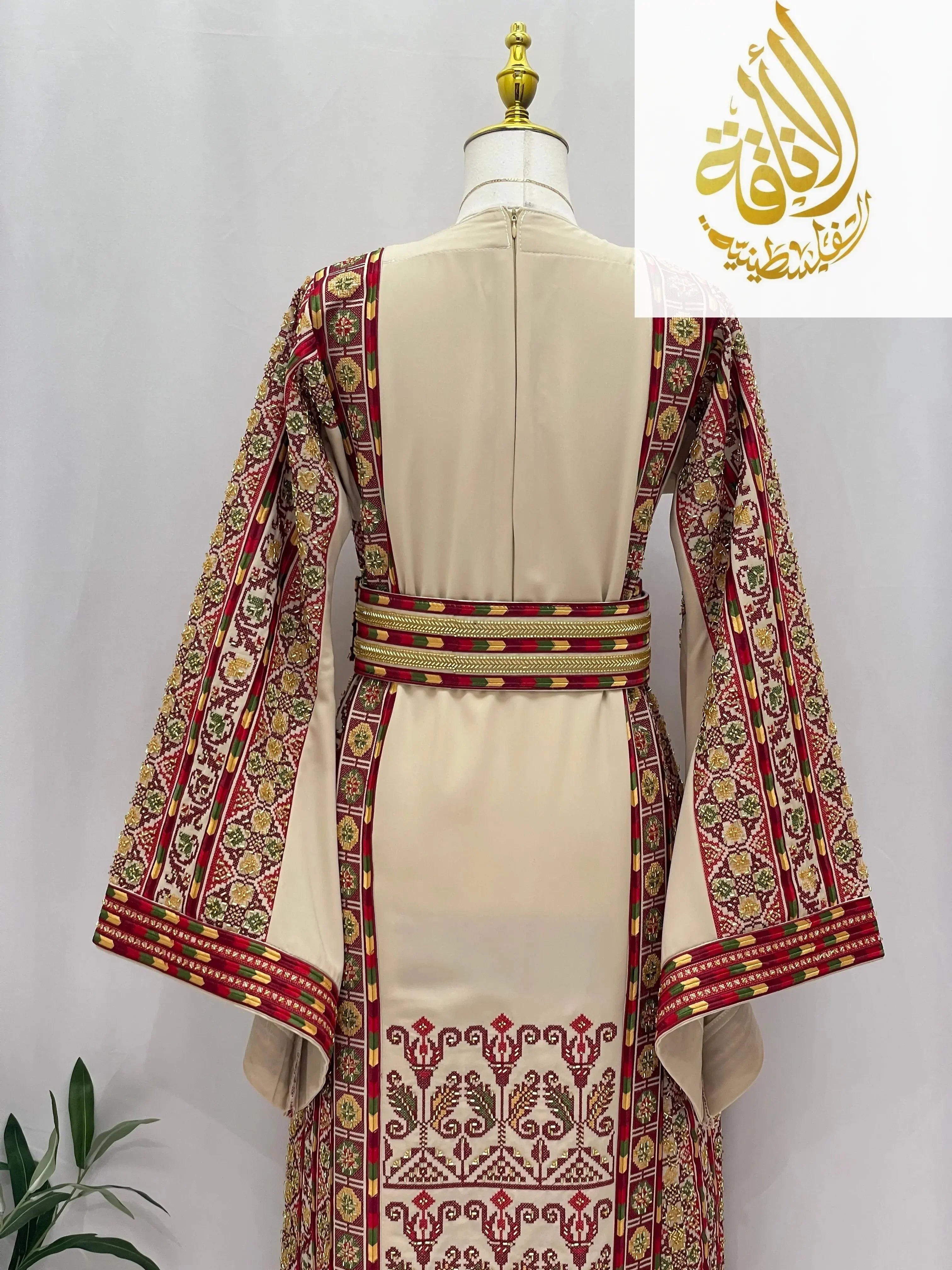Back view of Gold Beads Thoub by Palestinian Elegance featuring intricate red and gold bead embroidery on cream fabric