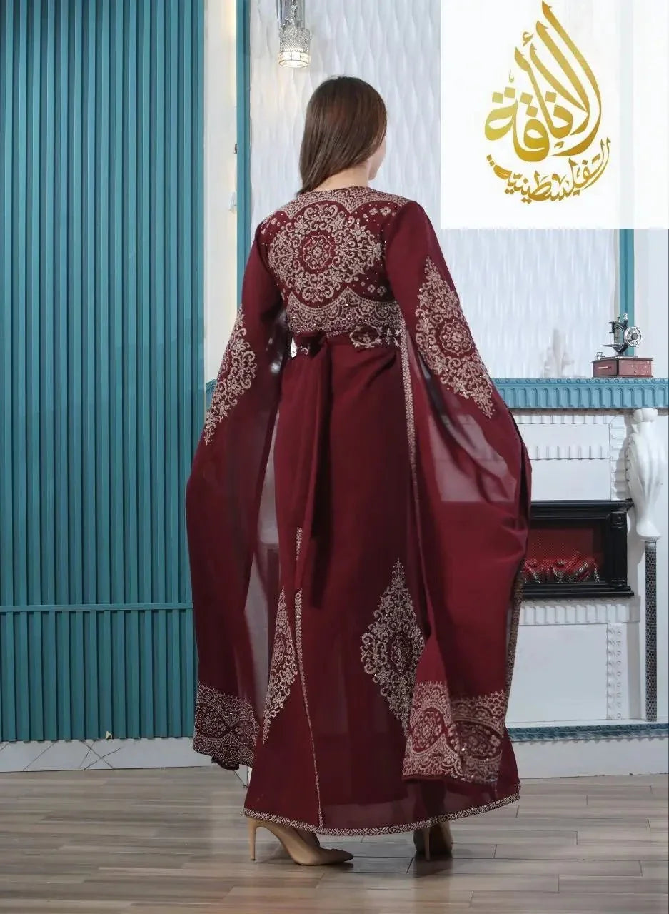 Maroon embroidered kaftan dress with intricate traditional patterns from Palestinian Elegance