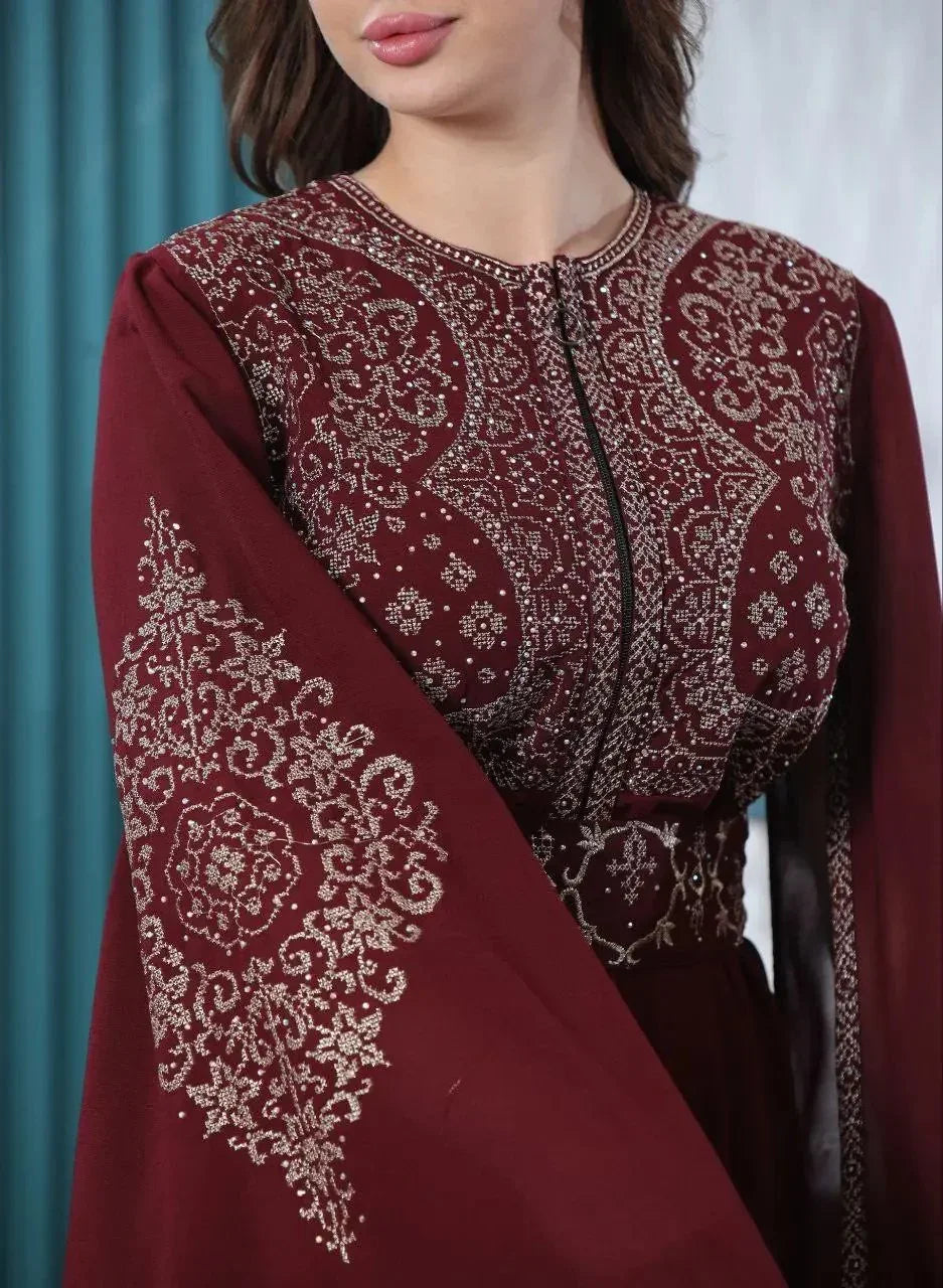 Embroidered kaftan dress in burgundy with intricate silver patterns by Palestinian Elegance