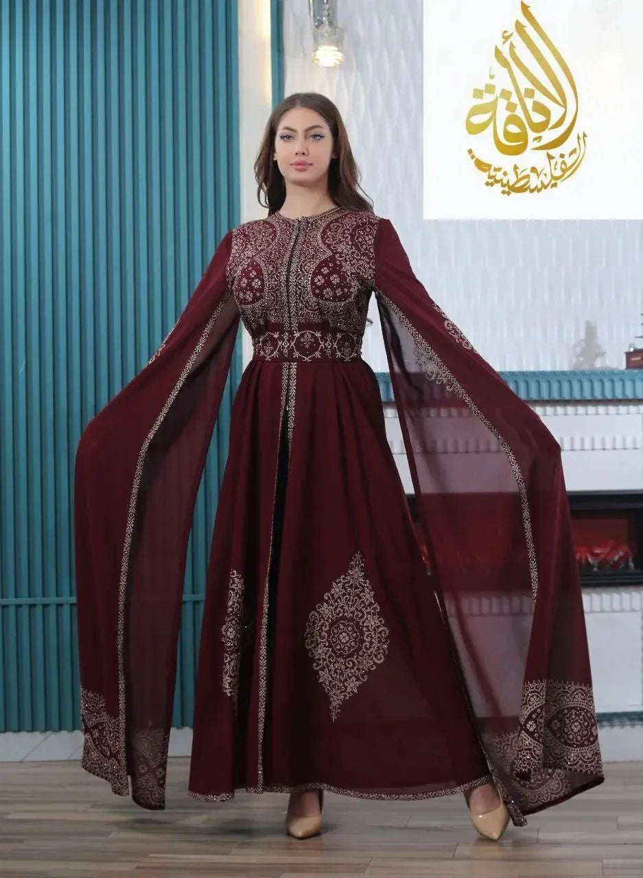 Palestinian Elegance embroidered kaftan dress in deep burgundy with intricate traditional embroidery and flowing sleeves