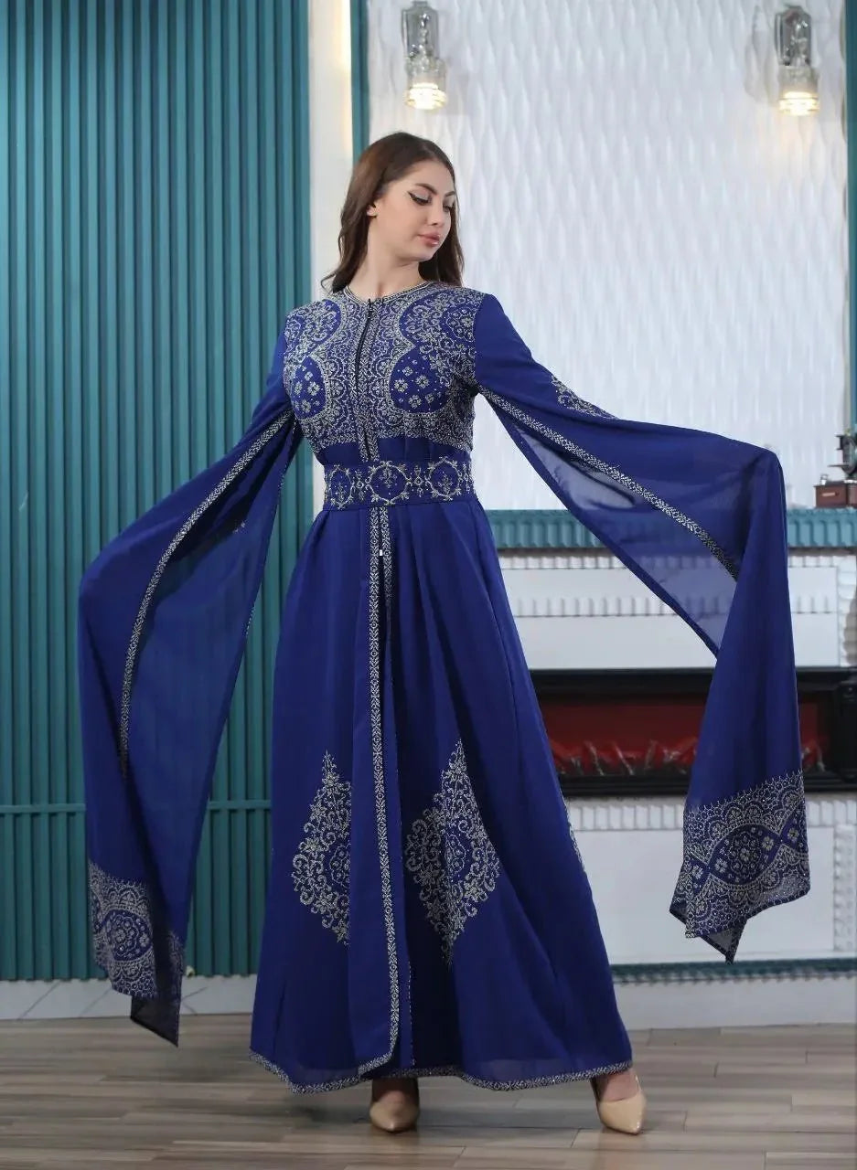 Palestinian Elegance blue embroidered kaftan dress with flowing sleeves and intricate silver detailing