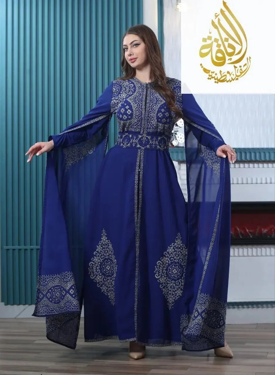 Palestinian Elegance embroidered kaftan dress in royal blue with intricate gold detailing and flowing sleeves