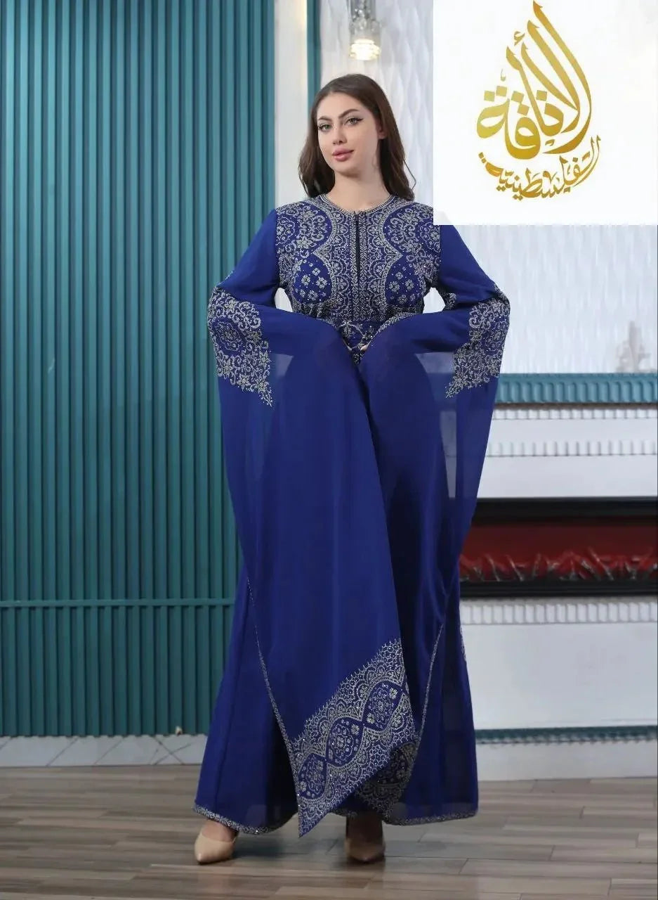 Palestinian Elegance blue embroidered kaftan dress with intricate silver patterns and flowing sleeves