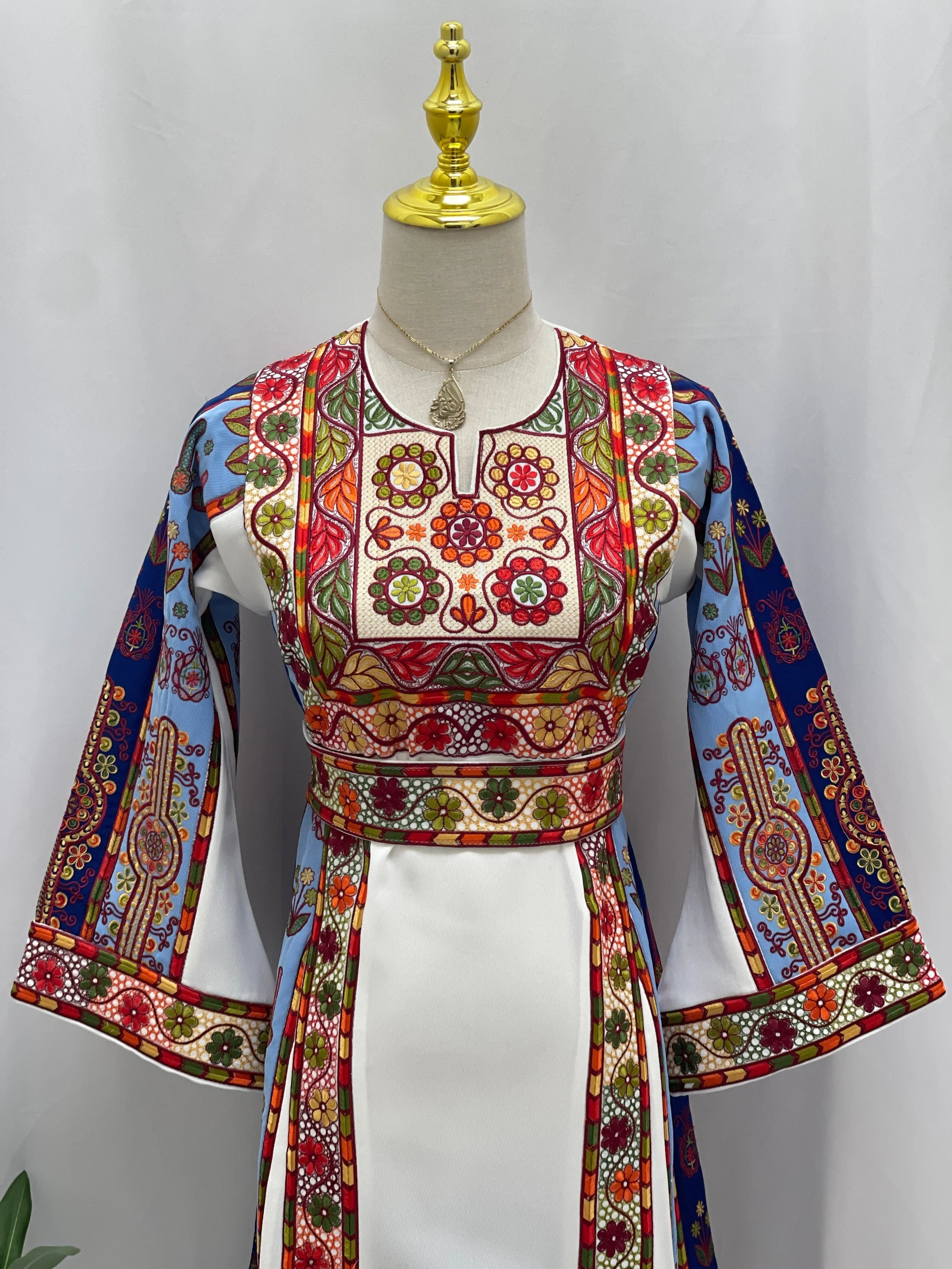 Embroidered Girls Thoub with colorful floral patterns and traditional Palestinian design details