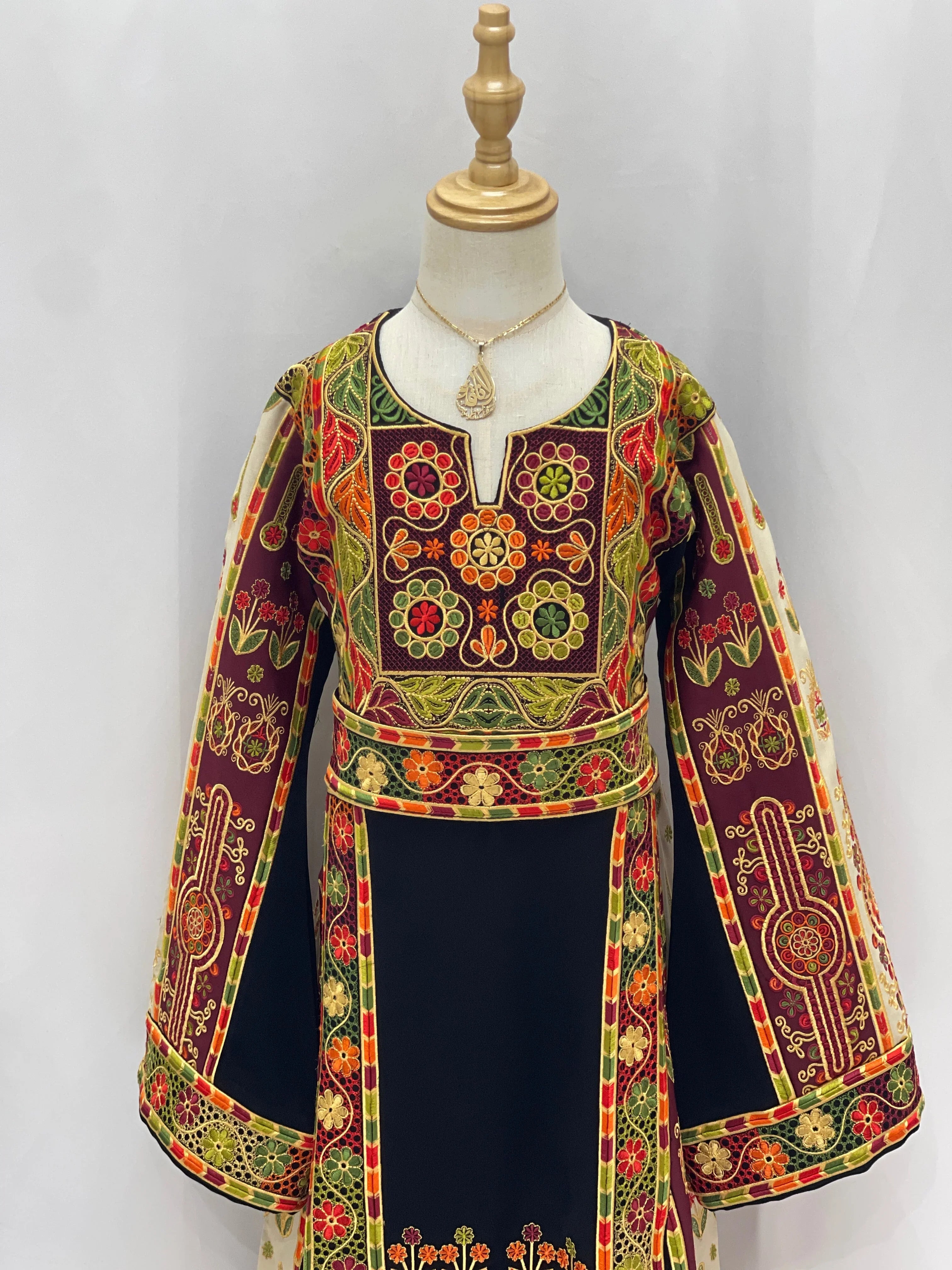 Embroidered Girls Thoub featuring vibrant floral designs and bell sleeves for stylish kids' wear