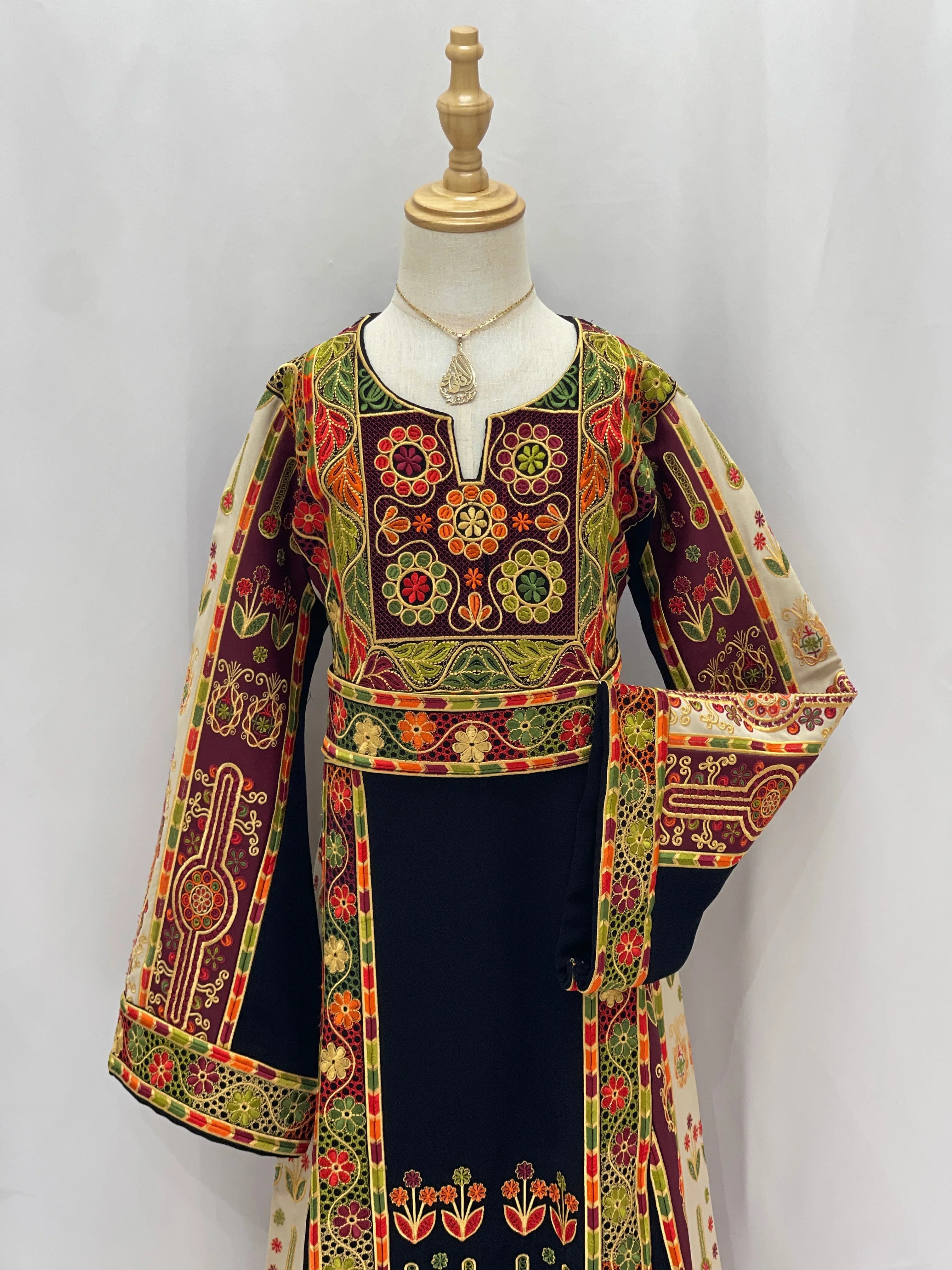 Embroidered Girls Thoub with colorful floral patterns and intricate designs, perfect for special occasions