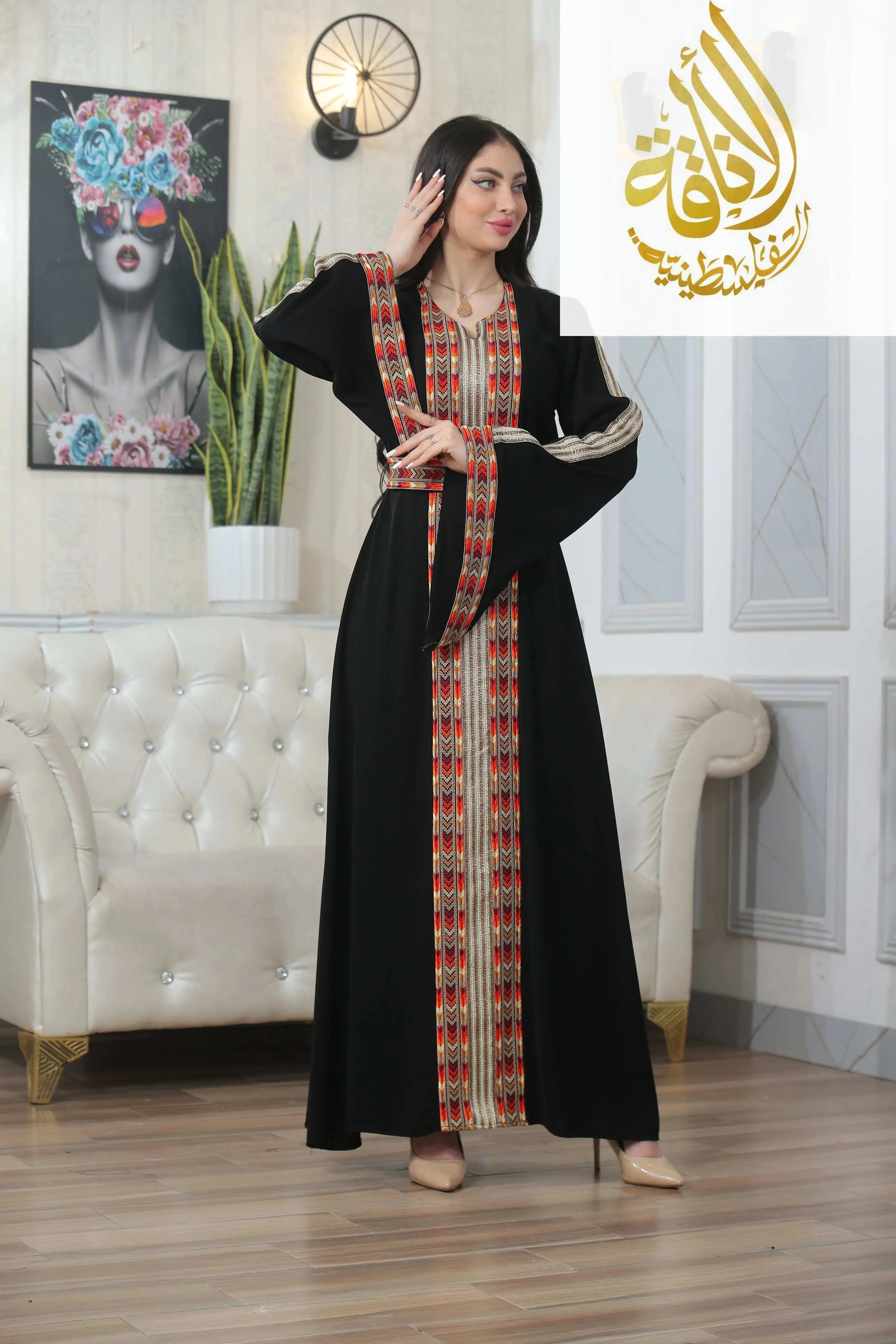 Woman wearing Palestinian Elegance Zena Embroidered Thoub in black with colorful traditional embroidery