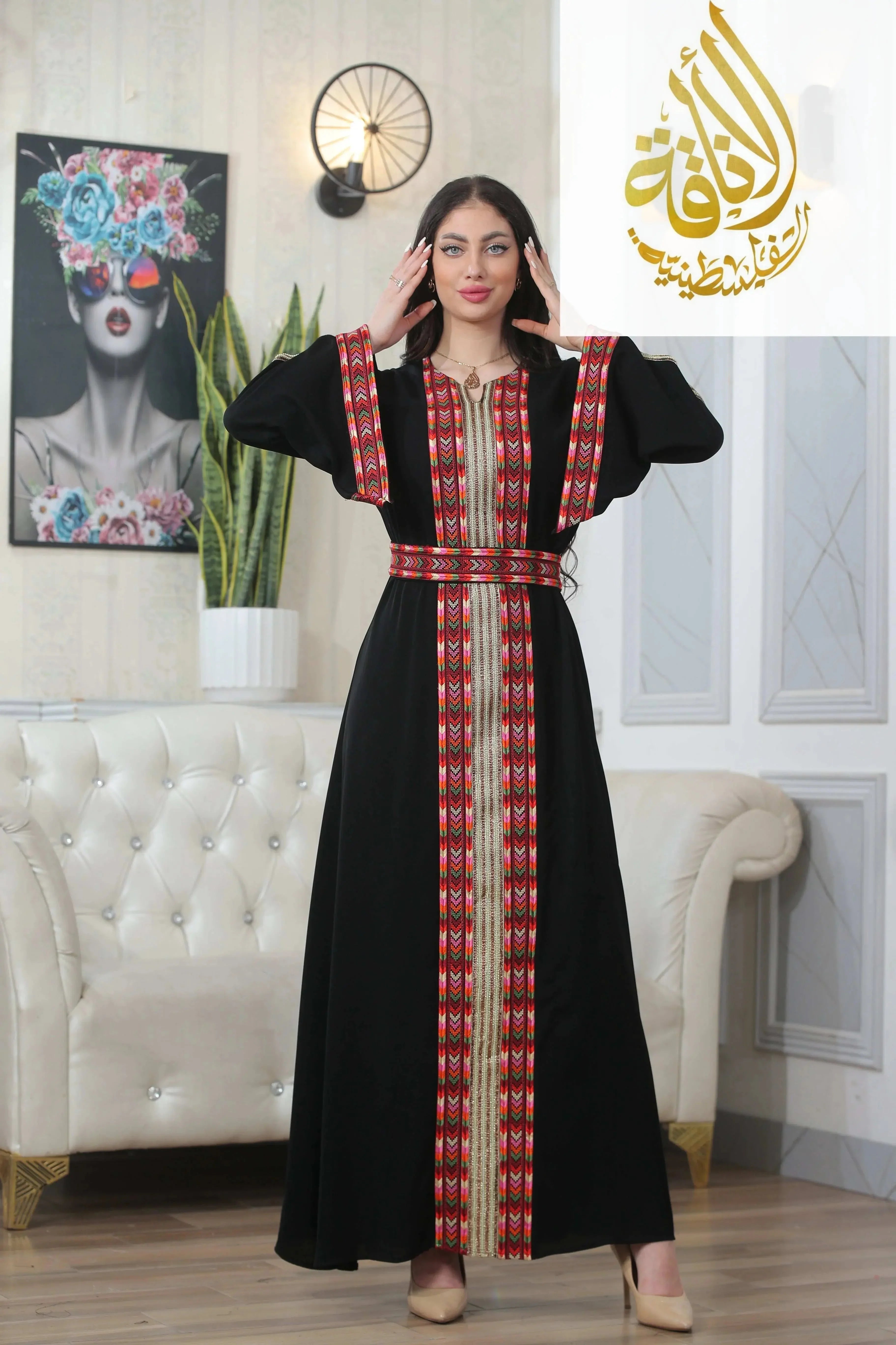 Woman wearing Palestinian Elegance Zena Embroidered Thoub with red and black traditional patterns