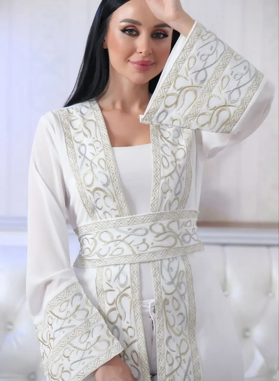 White Arabic letter embroidered cardigan with gold detailed embroidery and wide sleeves by Palestinian Elegance