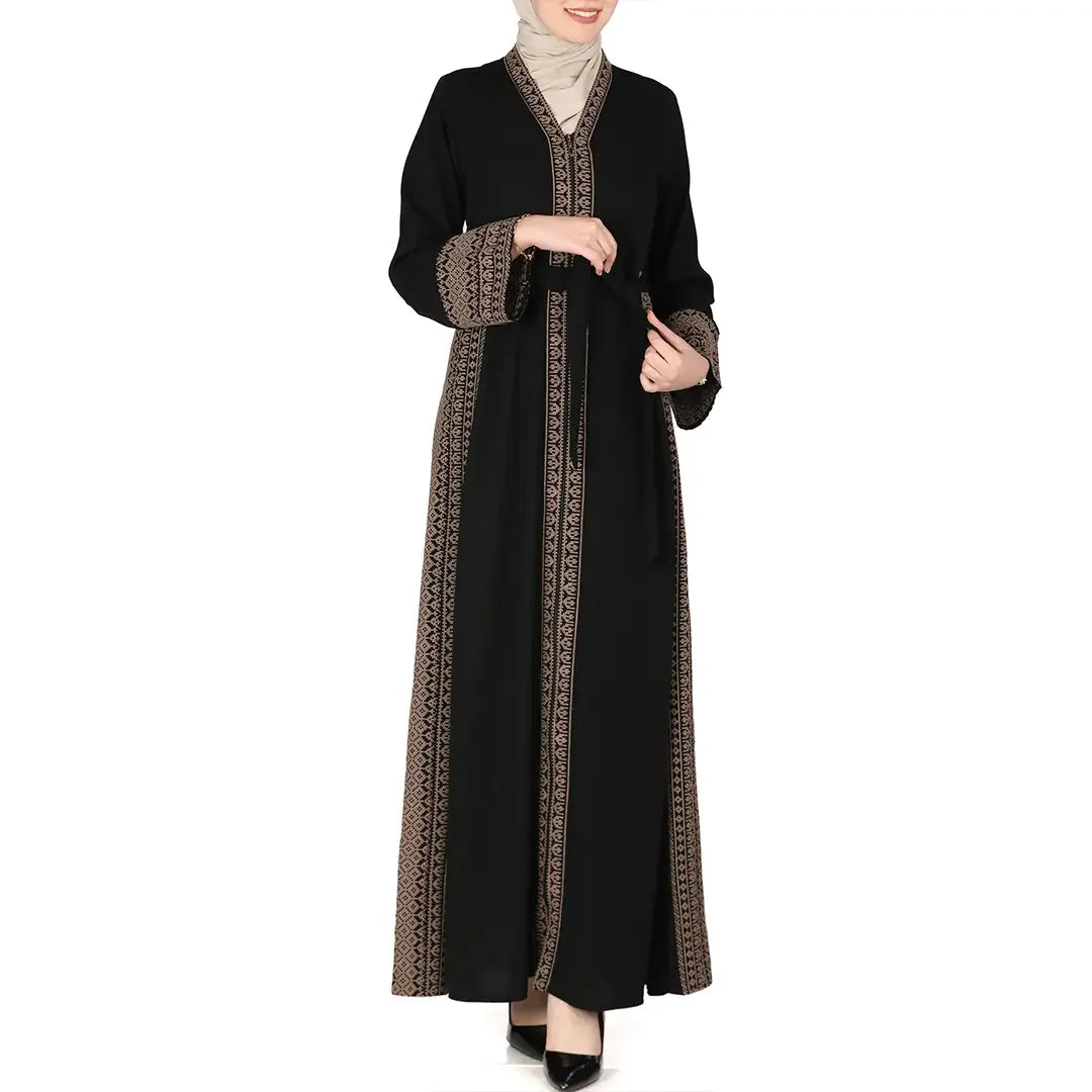 Black embroidered abaya dress by Palestinian Elegance with intricate patterns on sleeves and front edges