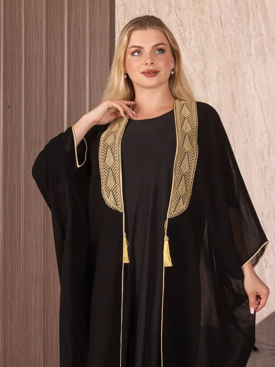 Black embroidered bisht for women cardigan with gold detailed trim and tassels by Palestinian Elegance