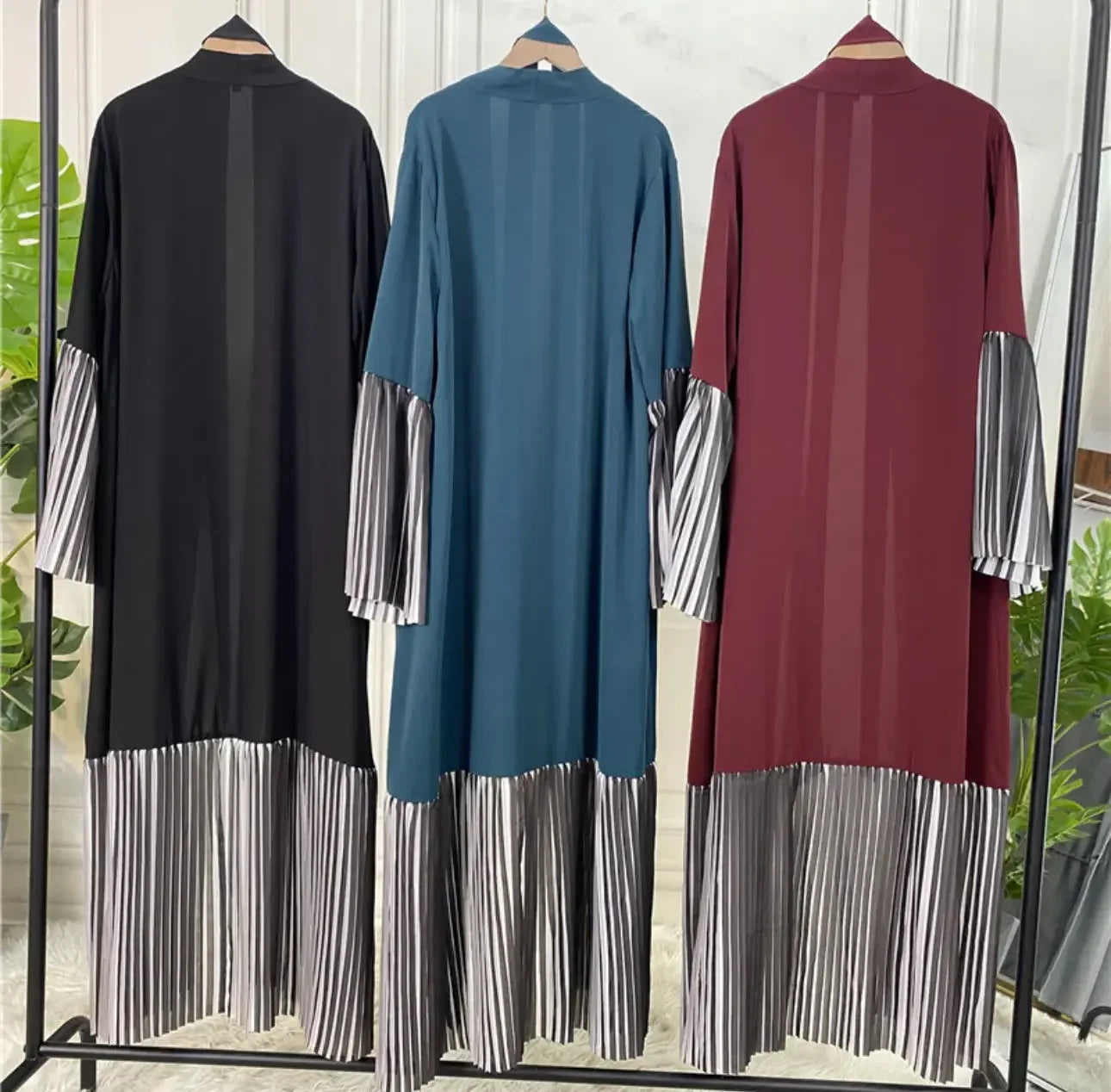 Palestinian Elegance flare sleeve abaya in black blue and maroon with striped lower and sleeve accents