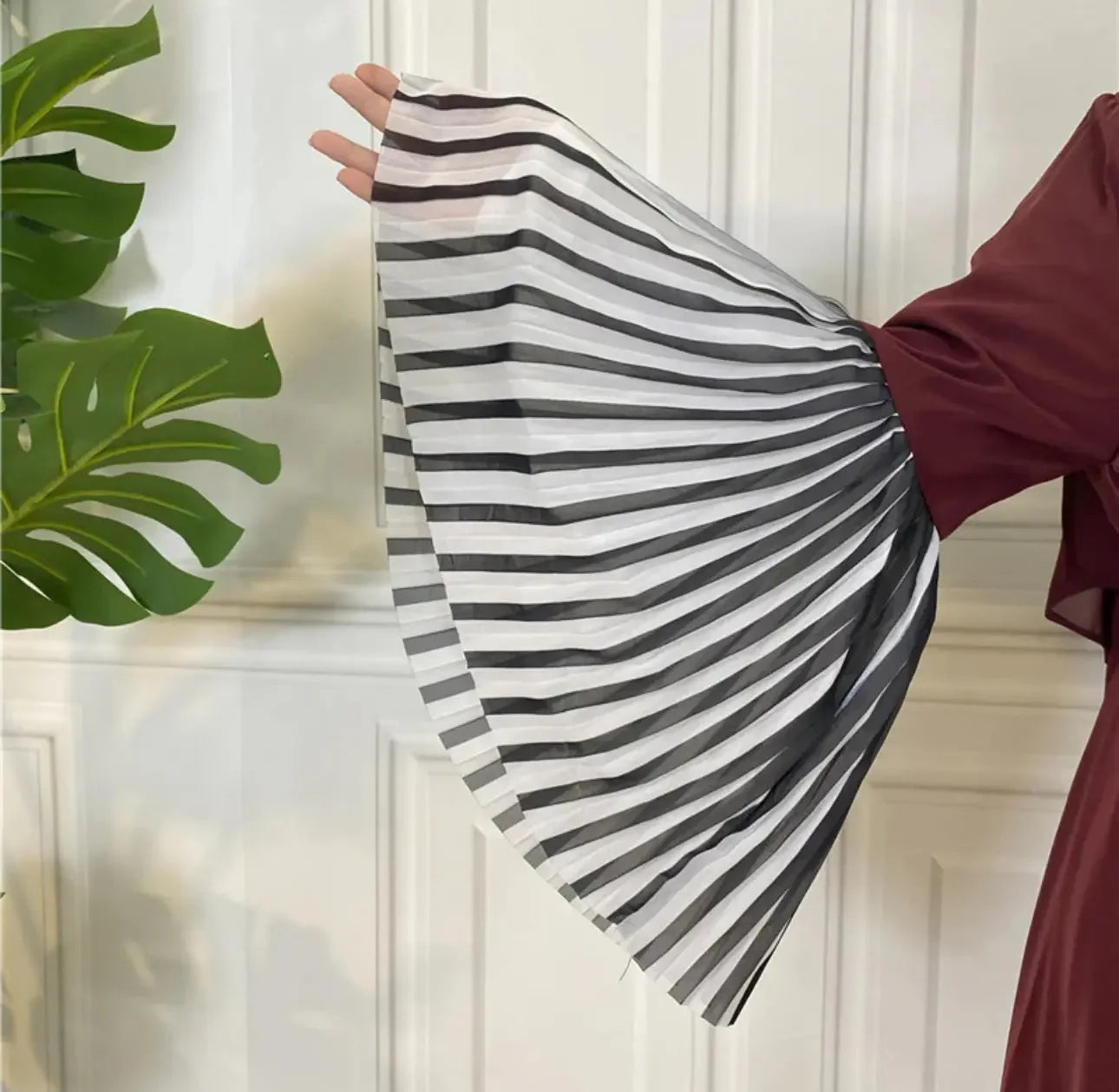 Palestinian Elegance flare sleeve abaya with black and white striped pleated sleeve detail