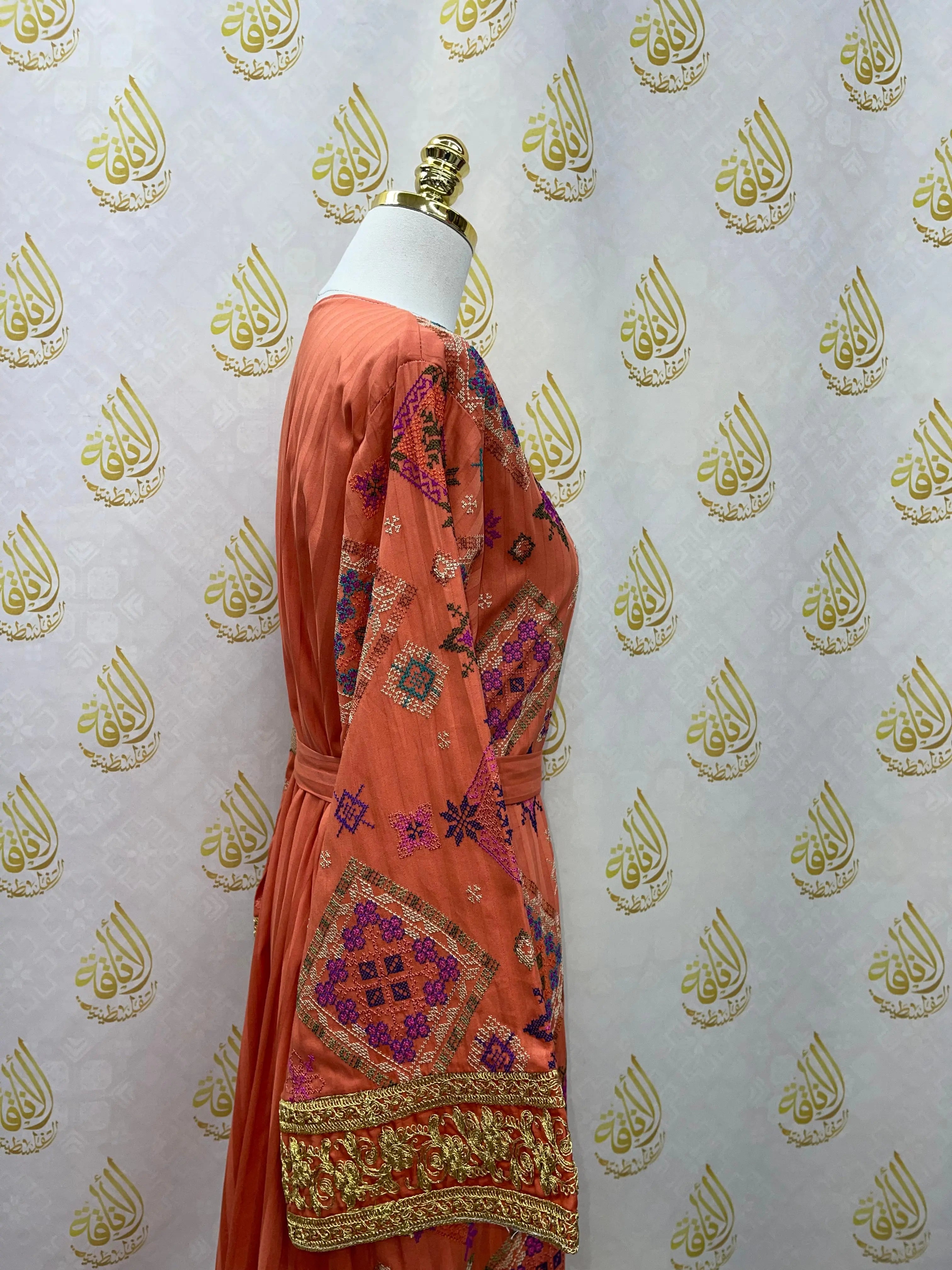 Gabani embroidered long cardigan in rust color with intricate multicolor embroidery from Palestinian Elegance