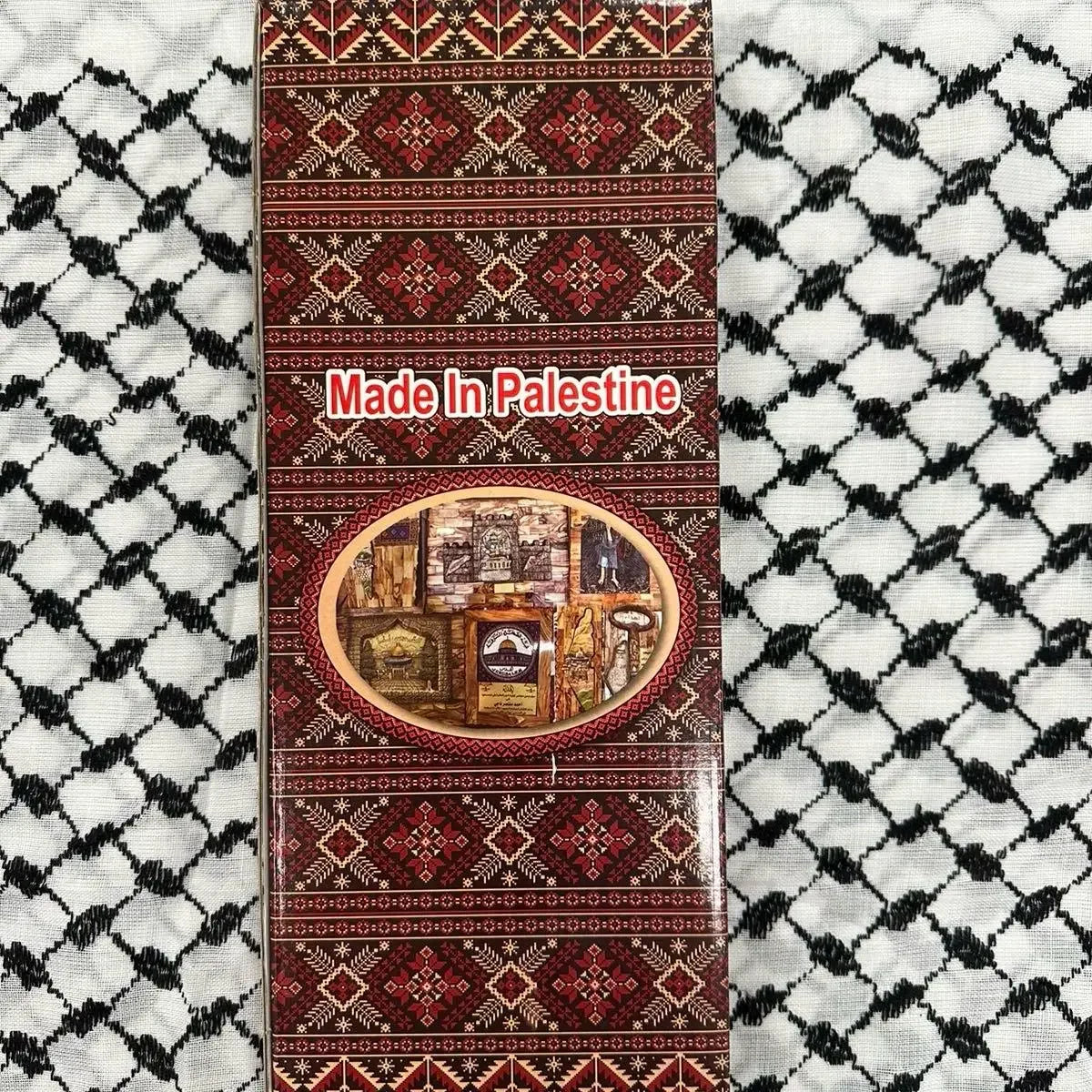 Palestinian Elegance handmade Palestine map wall art packaging with traditional patterns on black and white fabric background