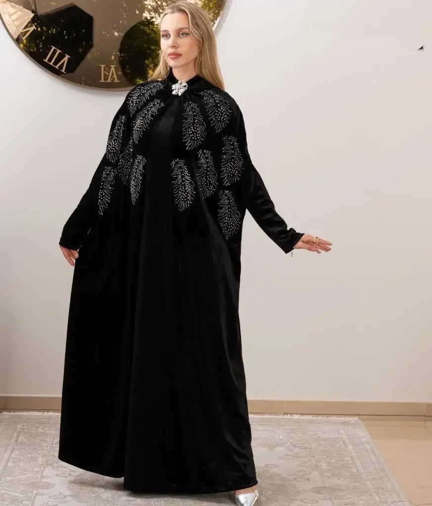 Palestinian Elegance luxury velvet abaya in black with intricate silver embroidery and decorative clasp
