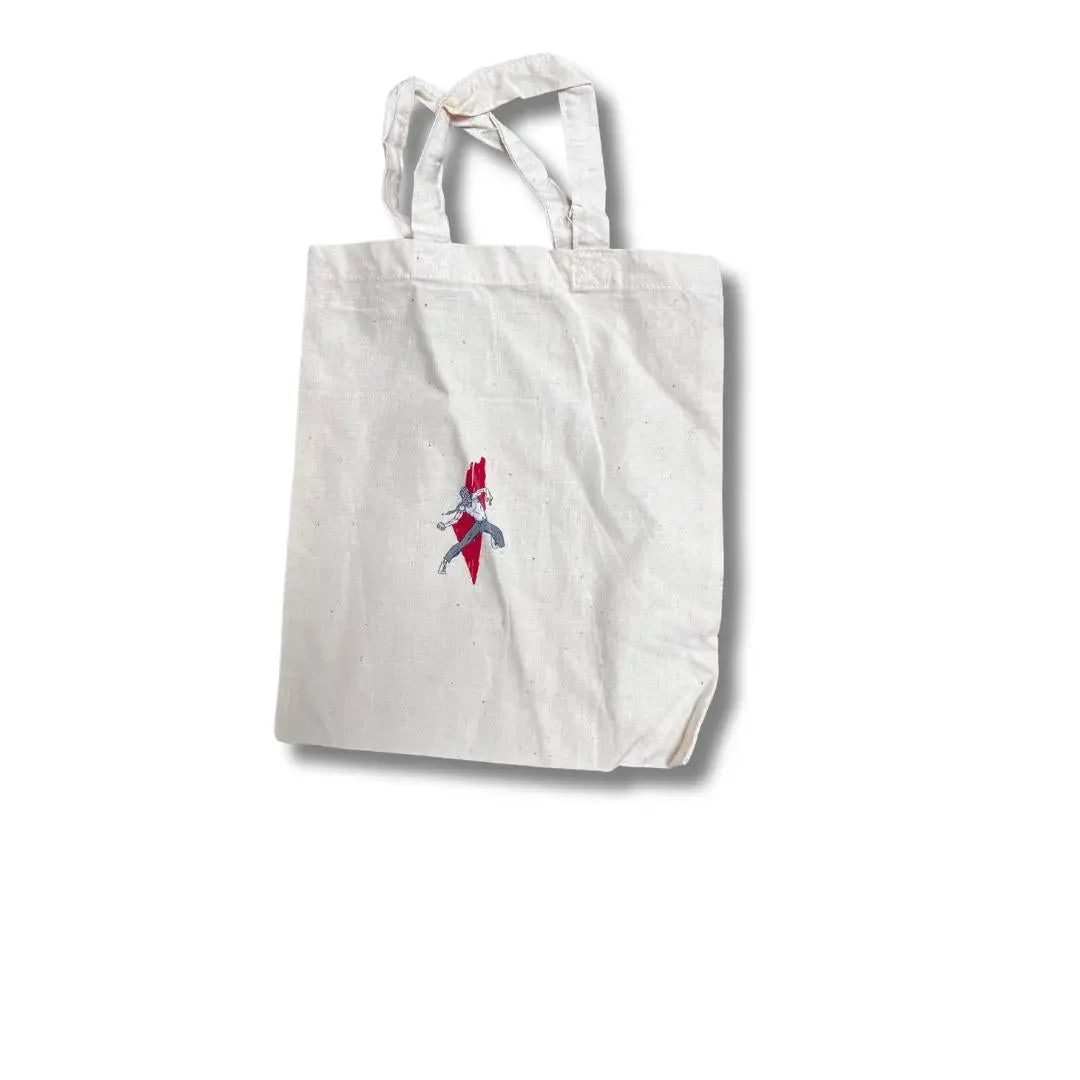 Palestinian embroidered handbag in white fabric with traditional red and black embroidery details