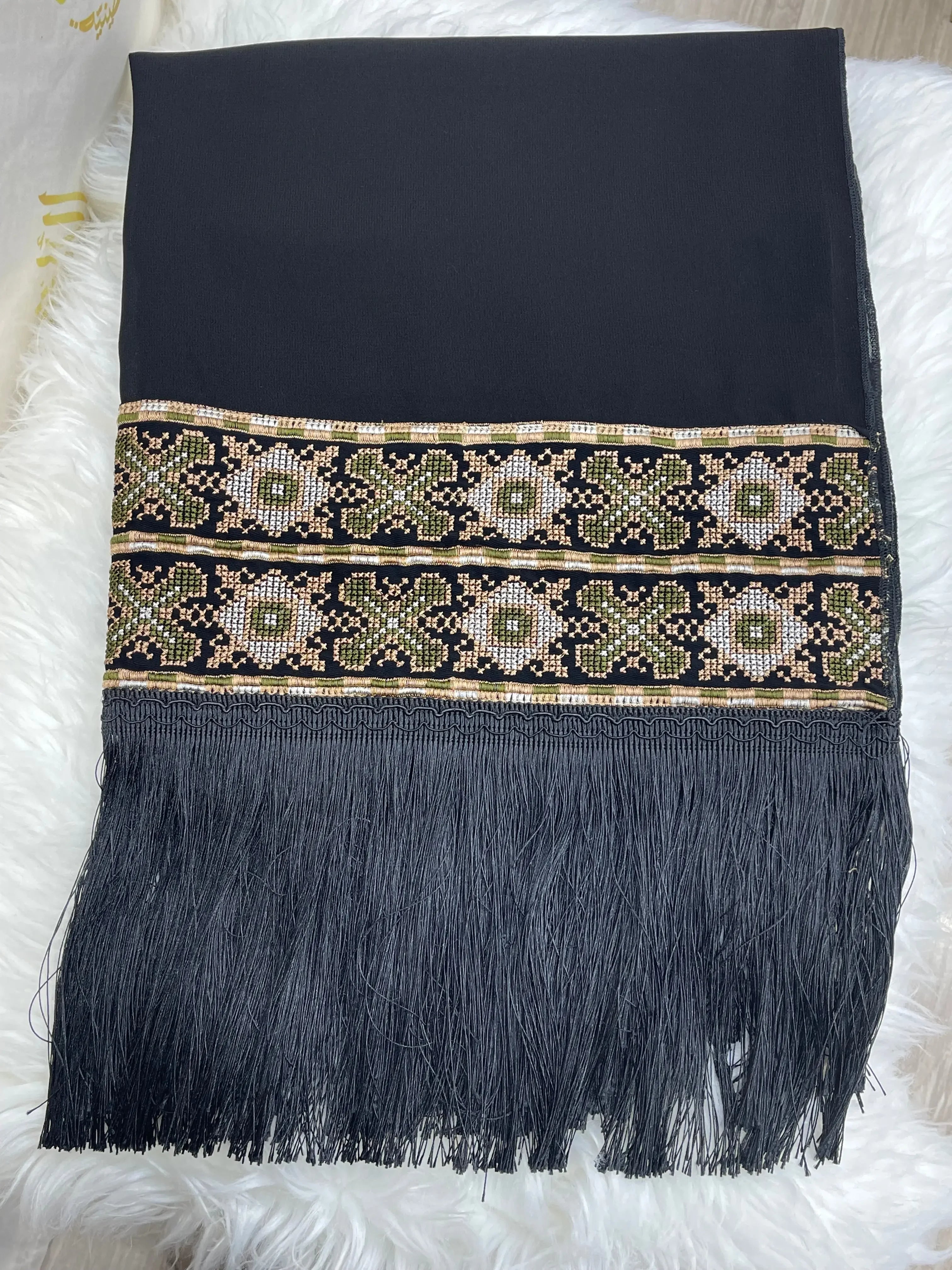 Palestinian embroidered shawl in black with intricate floral embroidery and long fringe detail