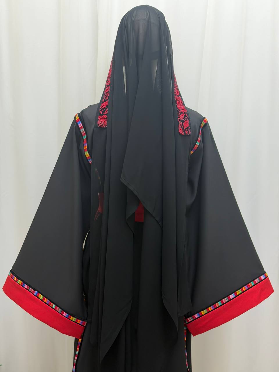 Thobe Al-Yaqout Al-Ahmar (The Red Ruby Thobe)