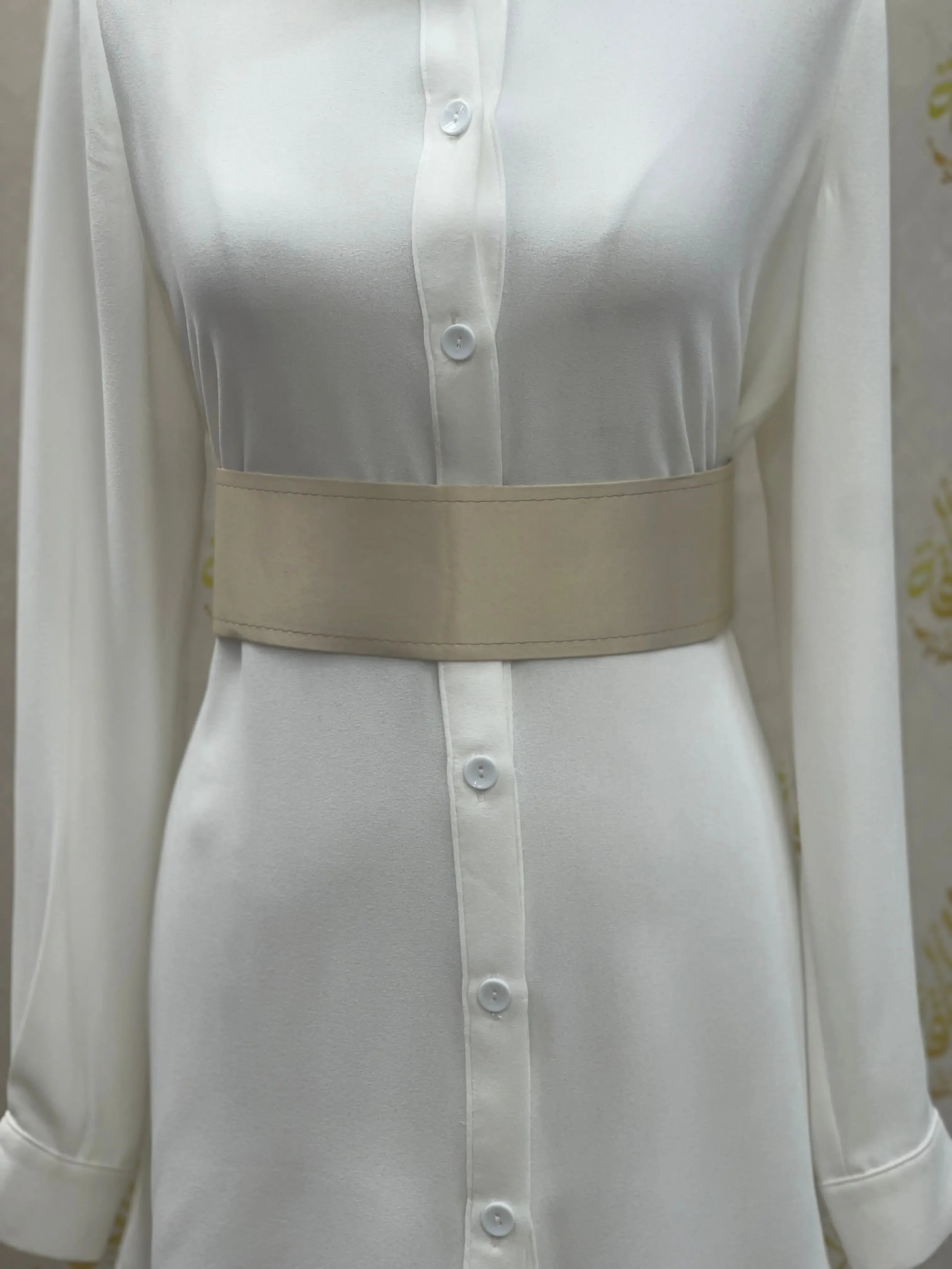 Palestinian Elegance beige satin waist belt paired with a white button-down dress