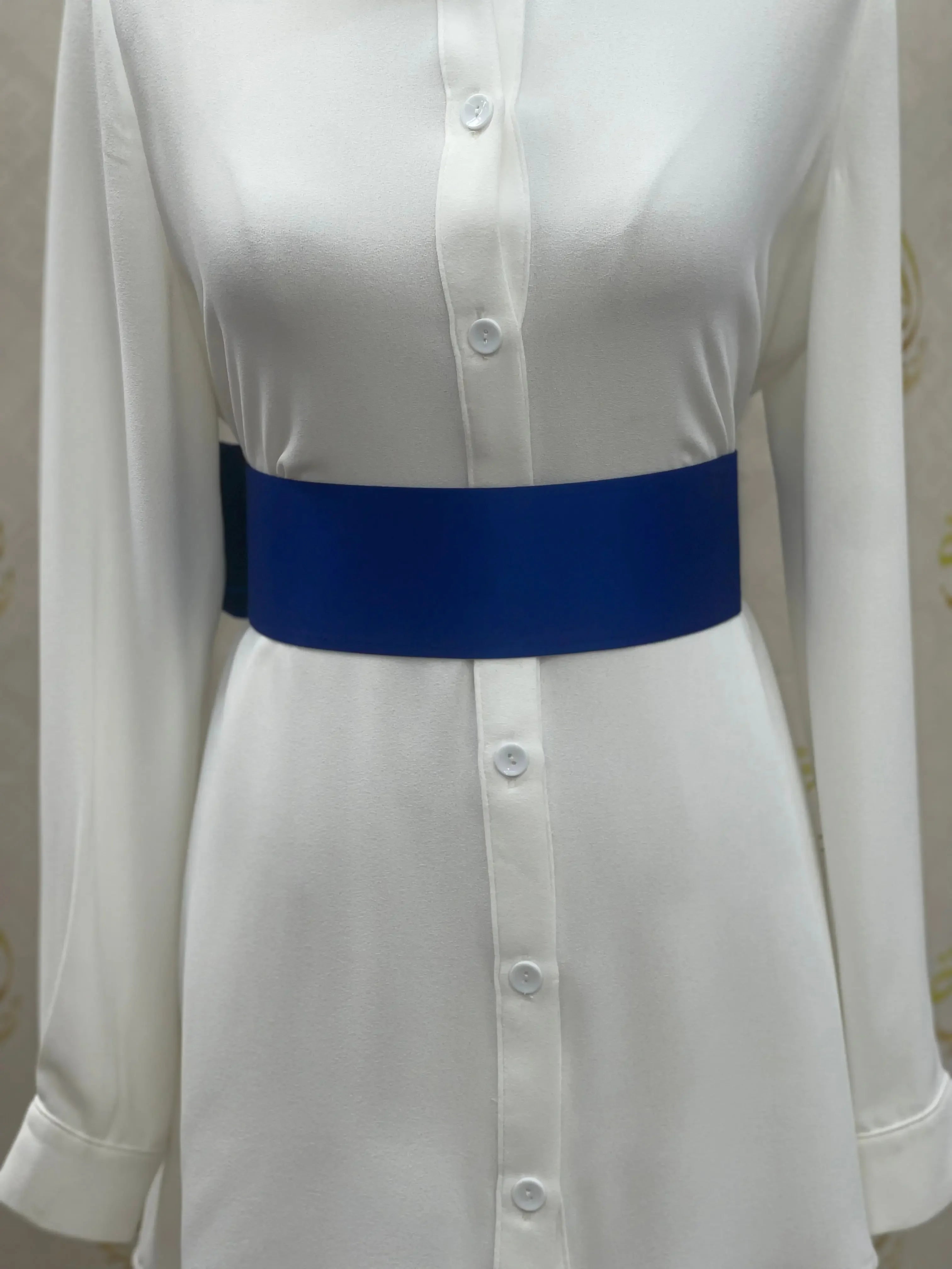 Palestinian Elegance blue satin waist belt styled on white button-down dress