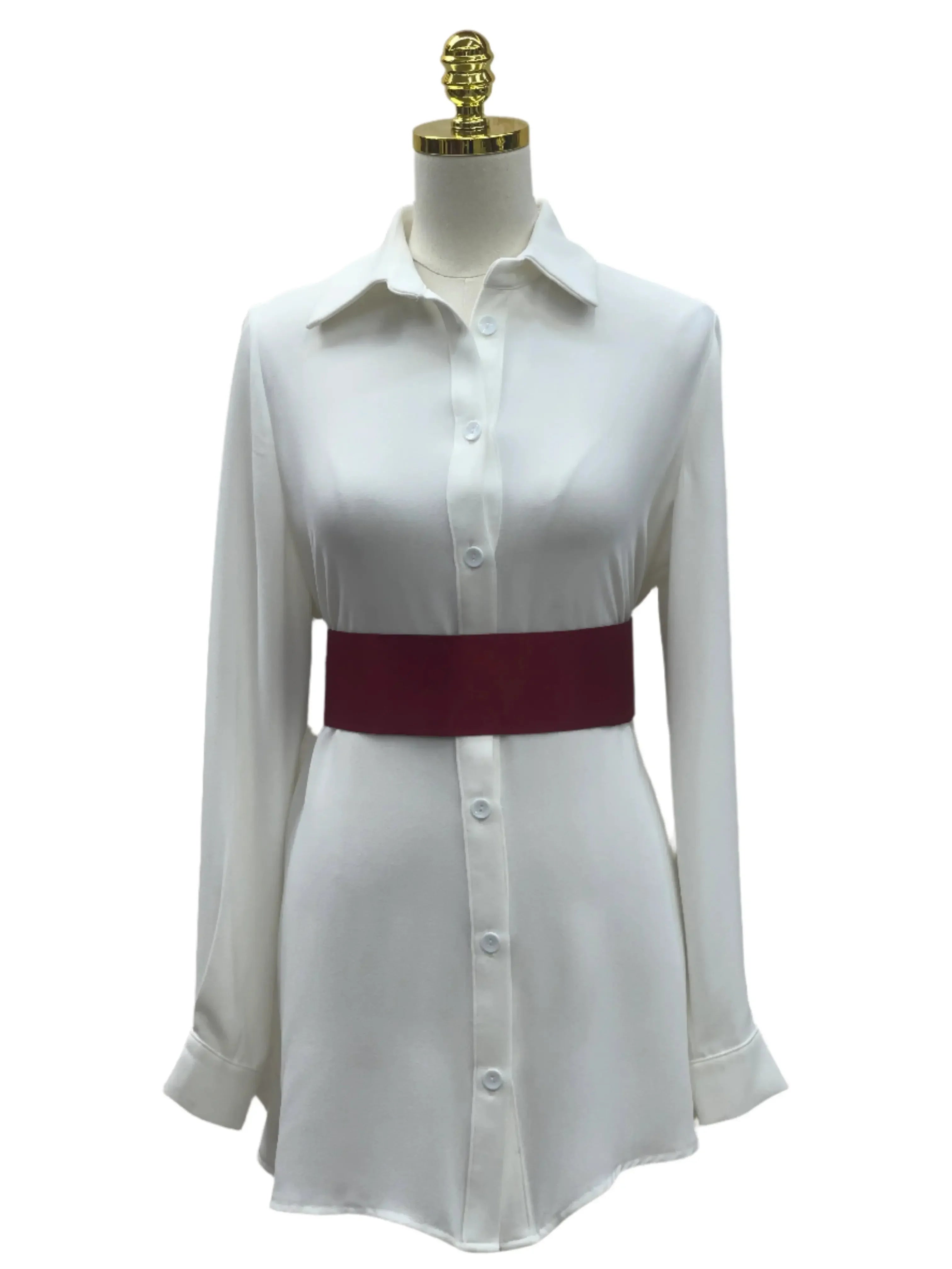 Palestinian Elegance satin waist belt in deep red worn over white button-down dress