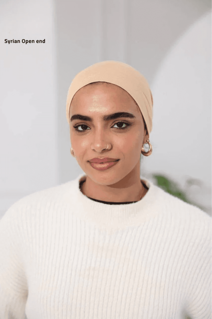 Palestinian Elegance beige Syrian-Style Open Bonnet headwear worn by a woman with gold hoop earrings