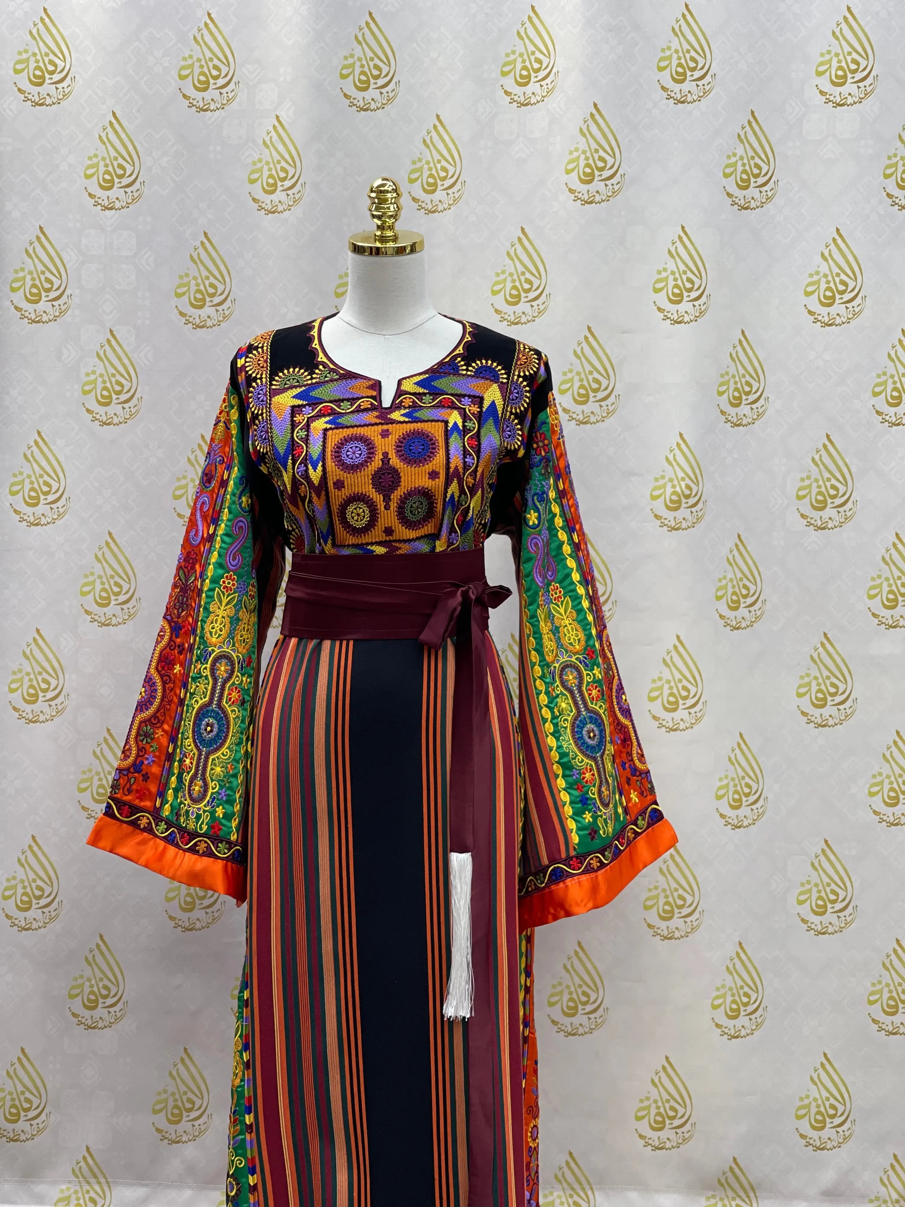 Palestinian Elegance embroidered traditional dress with colorful geometric patterns and striped skirt