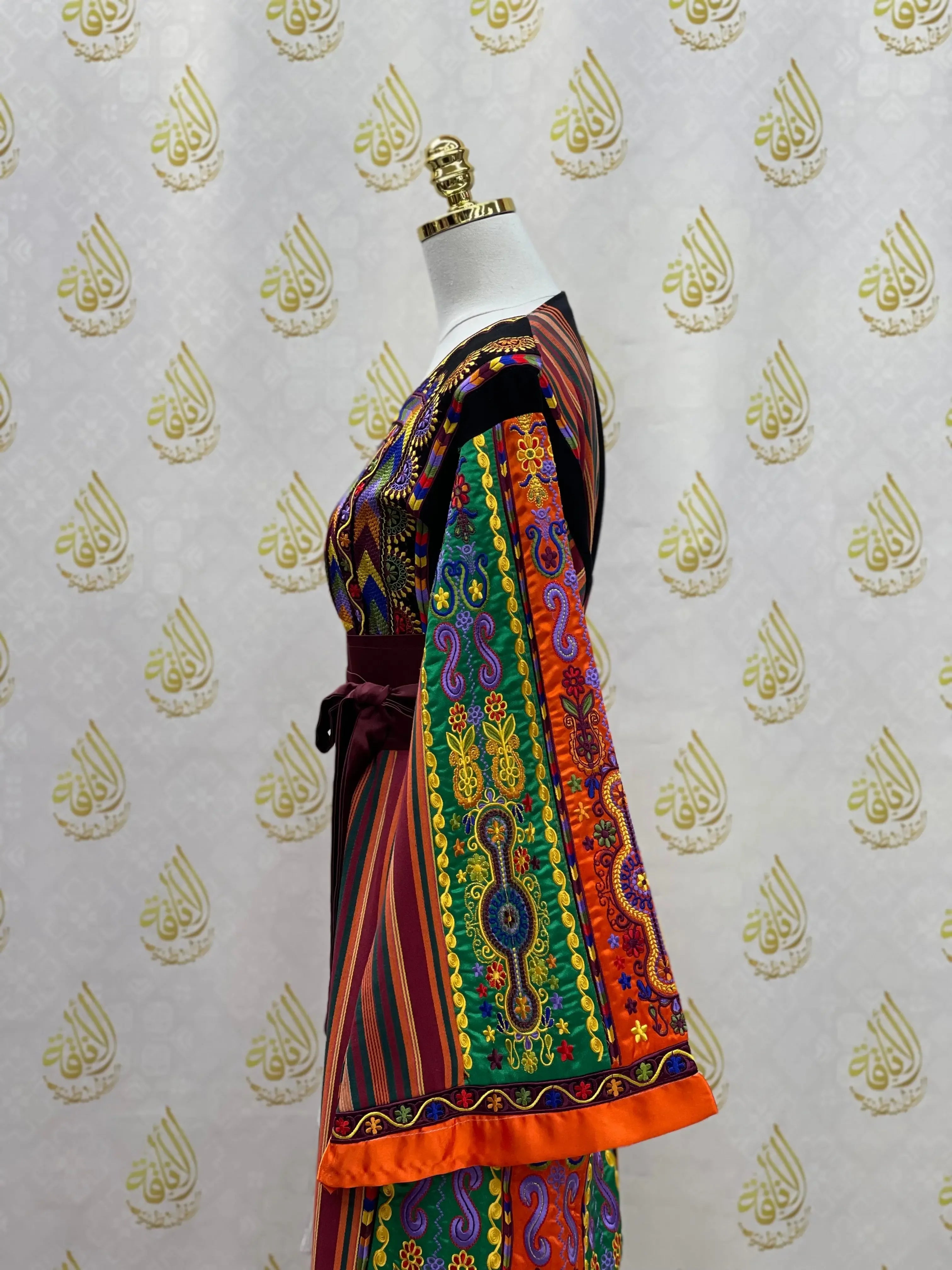 Palestinian Elegance embroidered traditional dress with colorful detailed patterns and wide sleeves