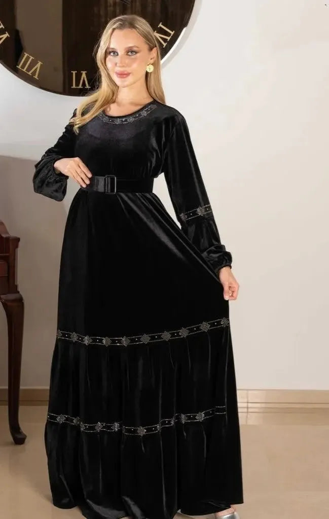 Black velvet casual dress with long sleeves and decorative belt by Palestinian Elegance